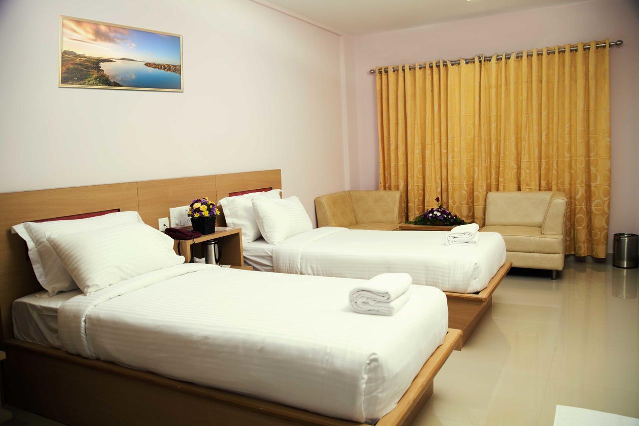 Hotel Rainbow Suites Каннур Экстерьер фото
